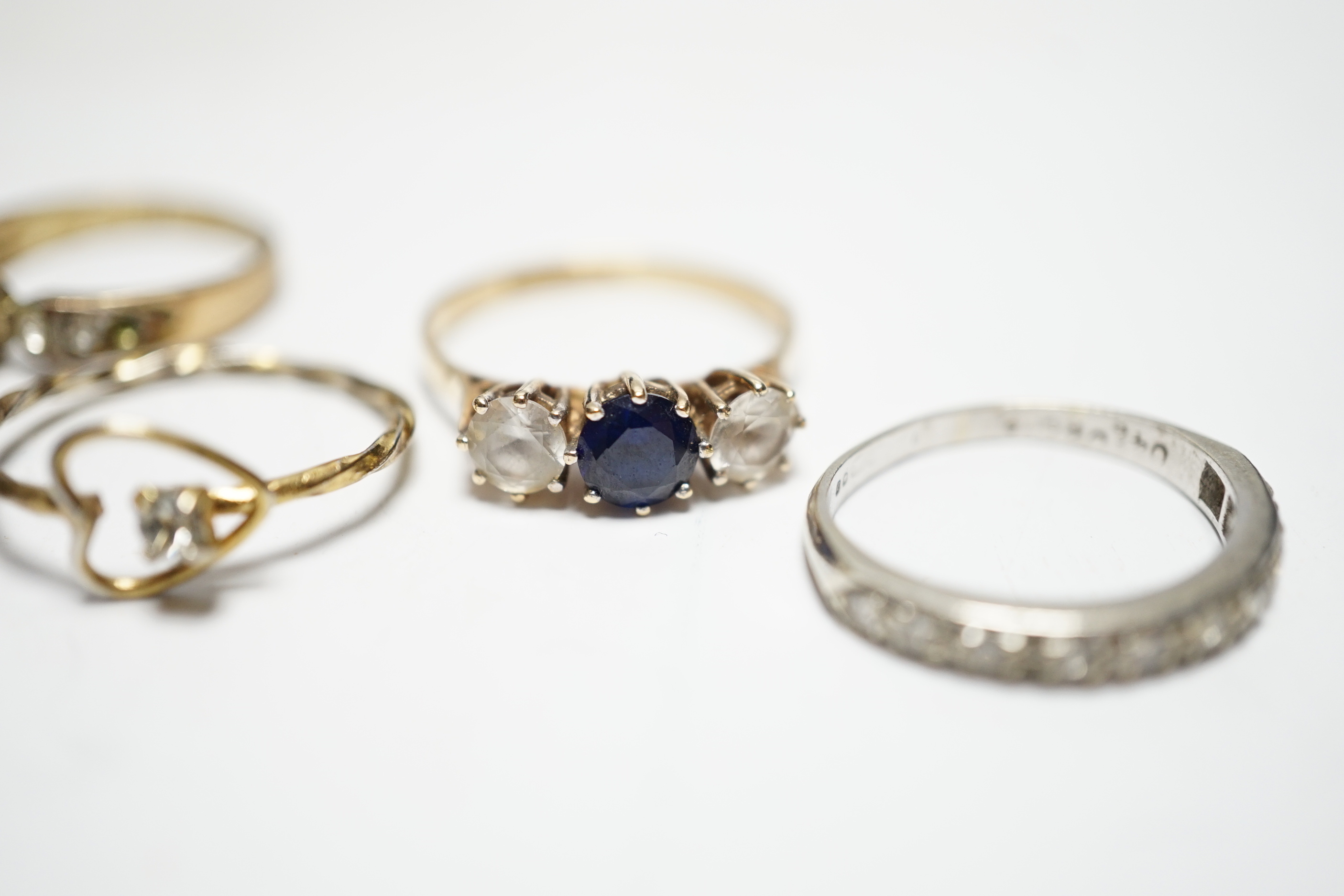 Two 9ct and gem set rings, including diamond chip half eternity and two other rings.